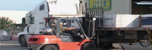 Loading forklifts with material in car parks 