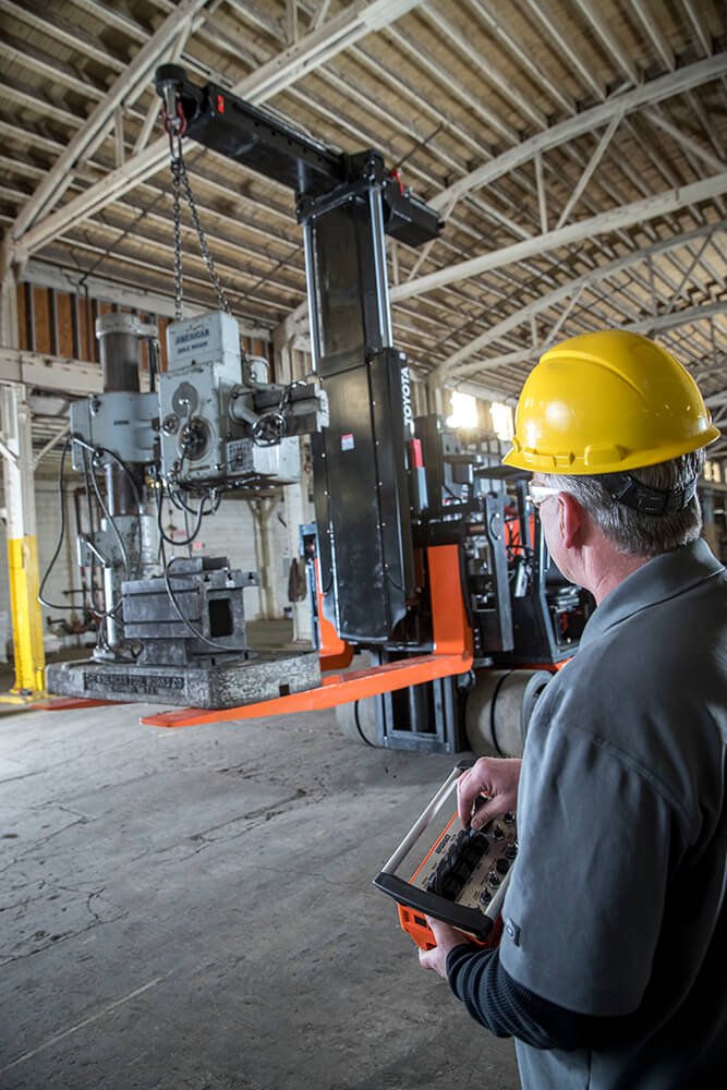 Man operating Toyota forklift in a warehouse