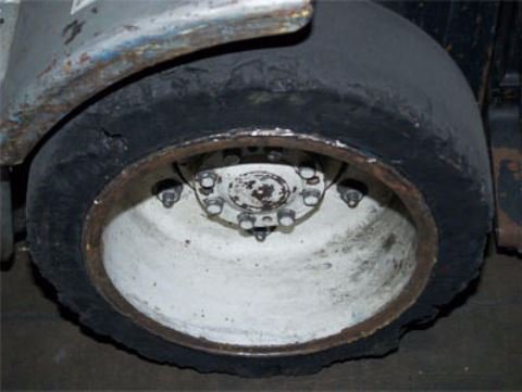 Close up of damaged forklift tire 