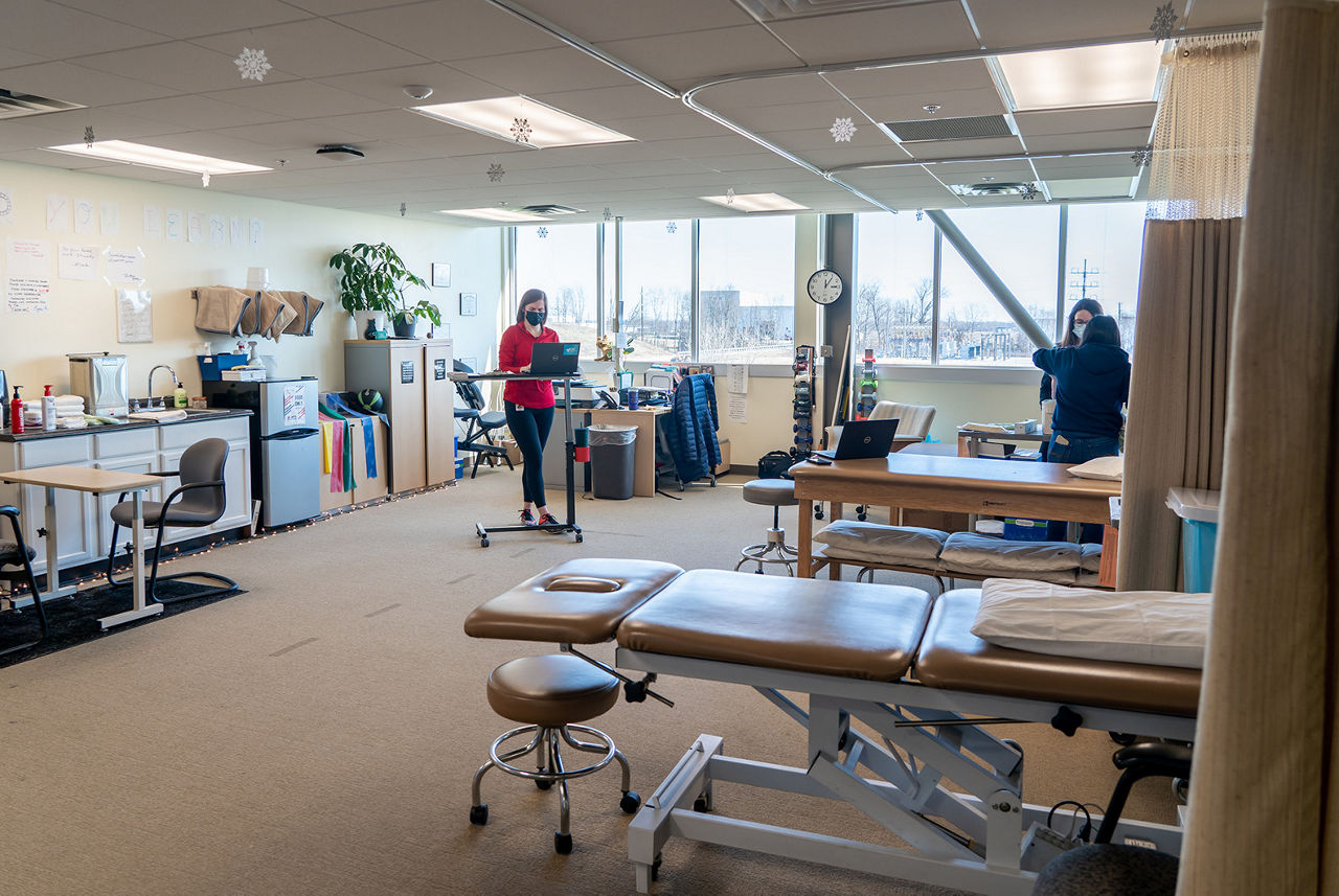 toyota physical training room. physical therapist assisting patient